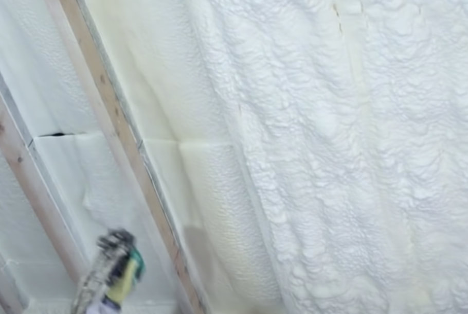 Applying 2nd coat of spray foam in attic